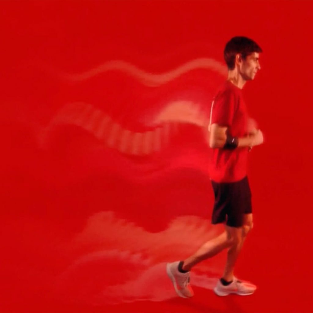 Man running on red background